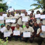 A group photo of the participants holding their certificates