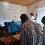 One of the participants writing on the white board